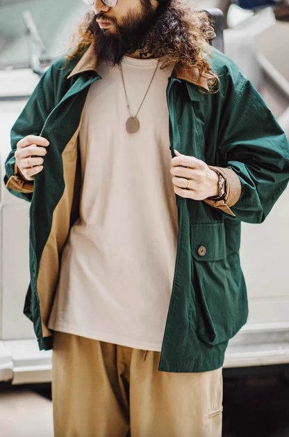 Dark Green Utility Field Jacket worn open front revealing inner layering and lightweight structure for versatile styling
