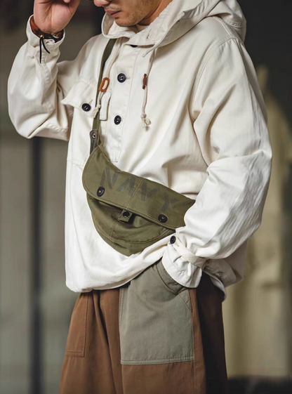Man wearing Off-White Utility Pocket Hooded Pullover Jacket with crossbody bag showing relaxed fit and vintage workwear styling