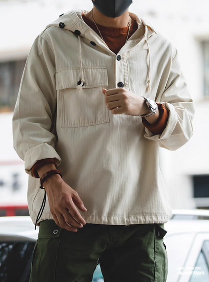 Man wearing Off-White Utility Pocket Hooded Pullover Jacket outdoors showcasing hooded design, utility pocket, and relaxed silhouette