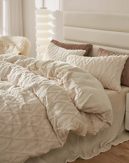 VelourRest ivory white rex rabbit fur duvet bedding set draped across bed with textured duvet cover and layered shams