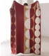 Red vertical geometric circle column plush knit throw blanket fully displayed with bold circular stripe pattern