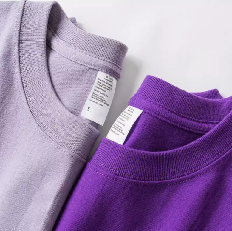 Vibrant T-Shirt Collection light purple and dark purple crewneck shirts close-up showing collar stitching and label
