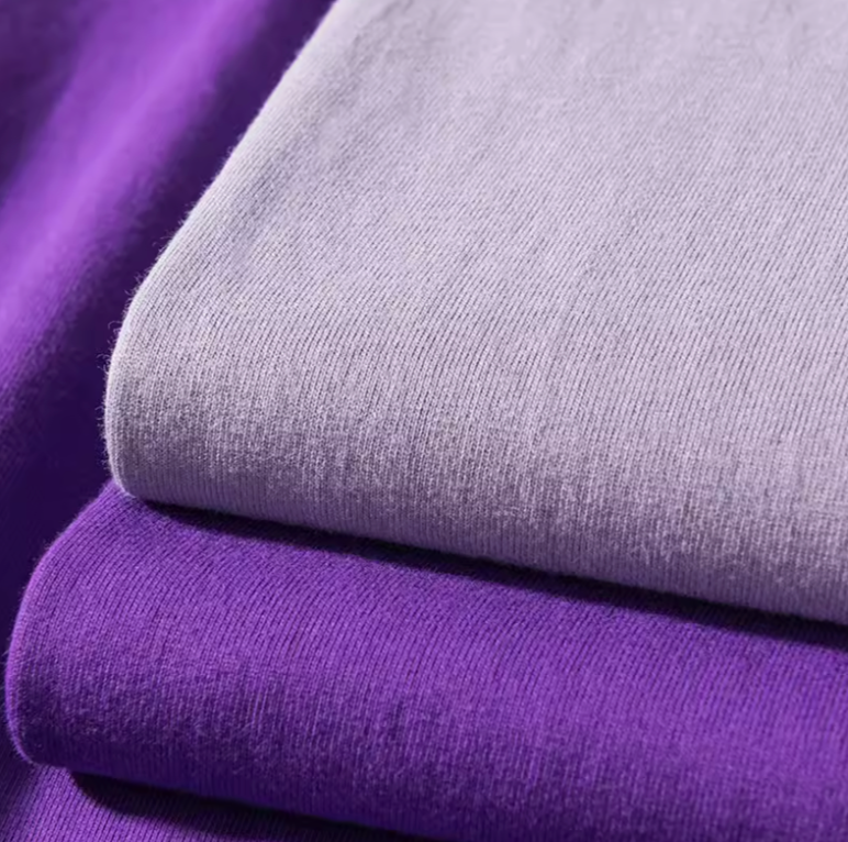 Vibrant T-Shirt Collection light purple and dark purple cotton fabric texture close-up showing soft material detail