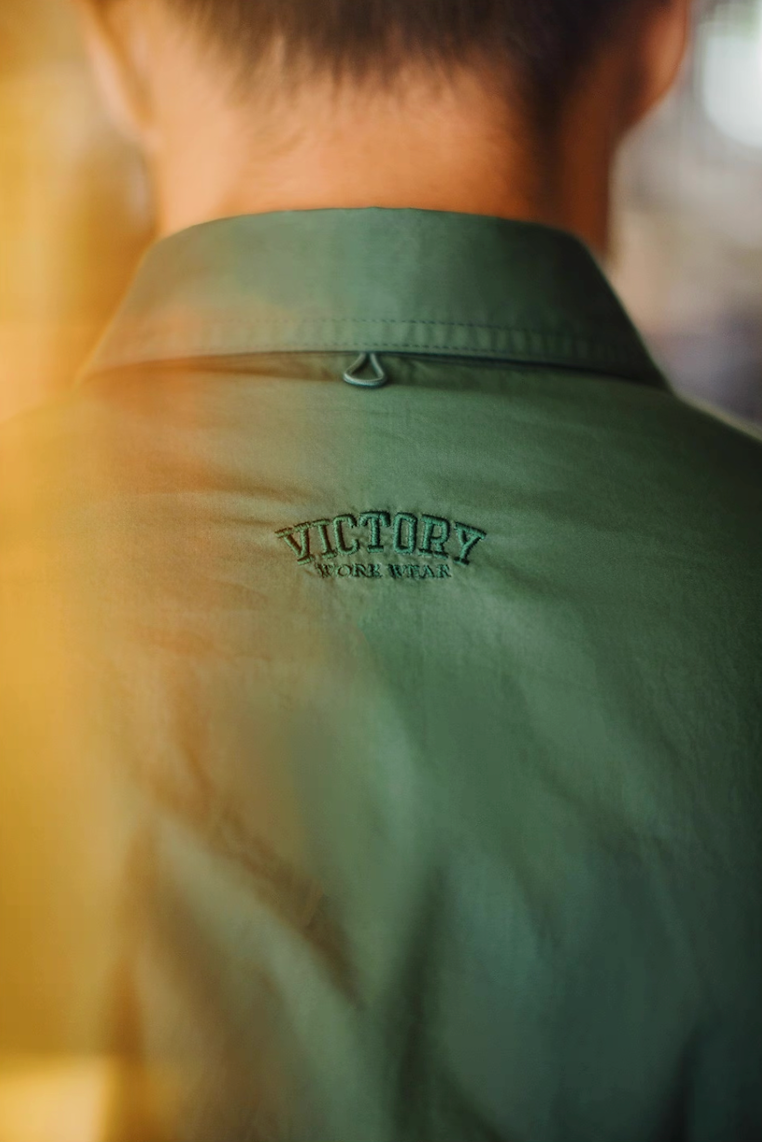 Back view close-up showing embroidered Victory logo under collar