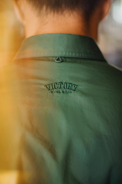Back view close-up showing embroidered Victory logo under collar