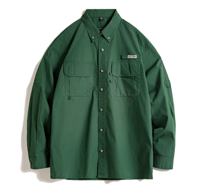 Flat lay of hunter green Victory utility shirt showing dual chest pockets and button-down collar