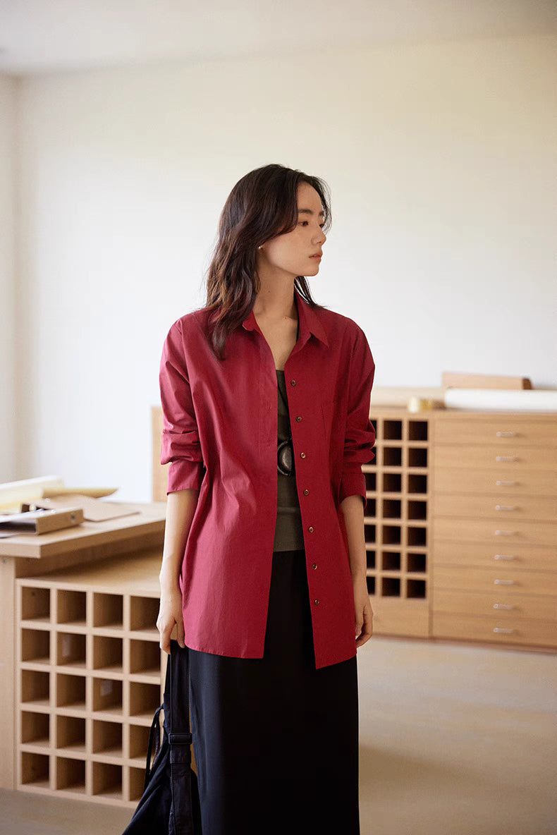 Woman wearing burgundy Vintage Air-Washed Cotton Shirt standing naturally, highlighting long sleeves, button closure, and relaxed silhouette