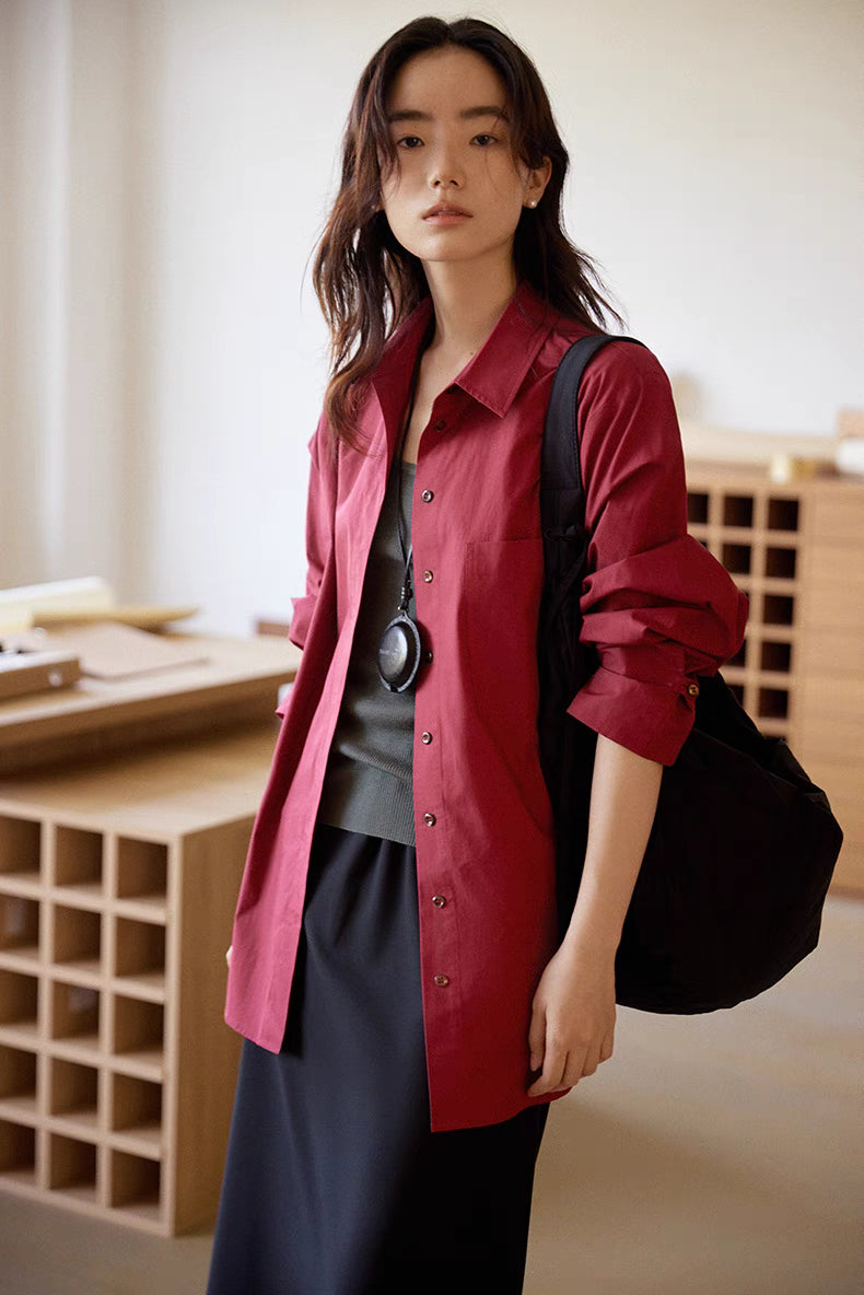 Woman wearing Vintage Air-Washed Cotton Shirt in burgundy front view with shoulder bag, showcasing relaxed fit, button front, and spread collar design