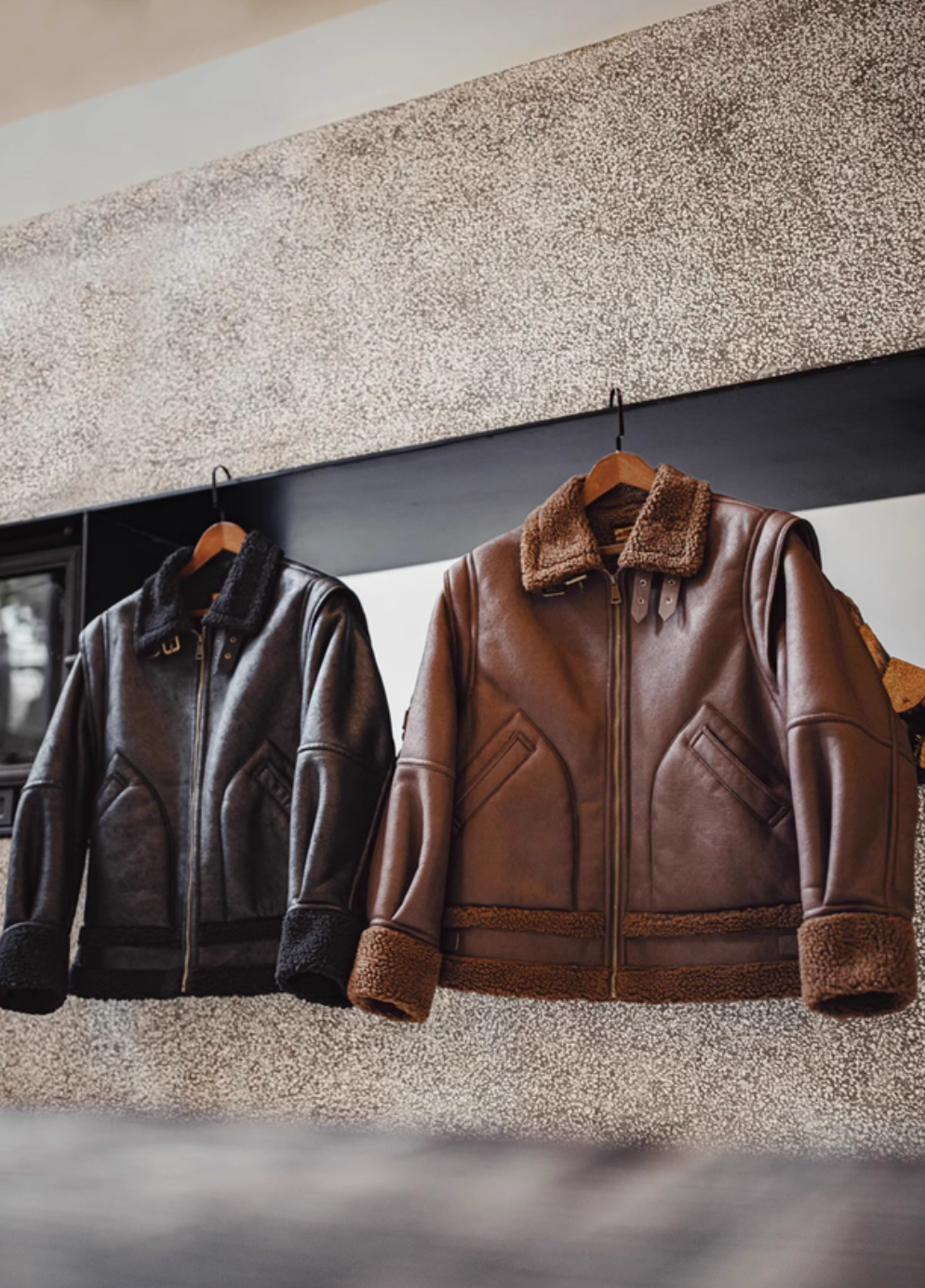 Vintage-Inspired Faux Sherpa B3 Bomber Jacket in Coffee Brown and Black hanging display showing sherpa collar and zip front design
