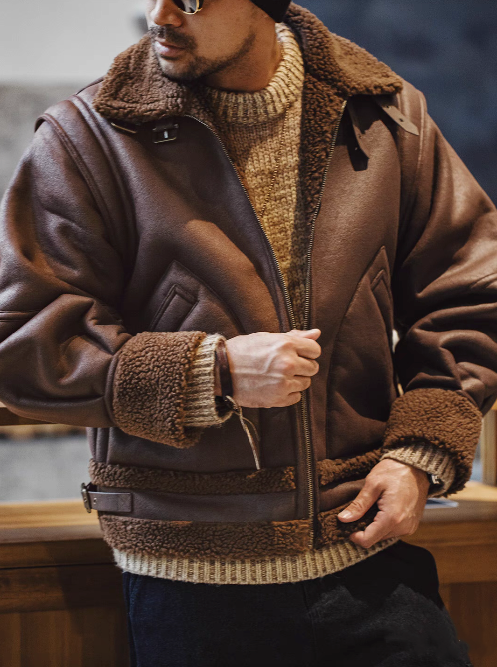 Close-up of Vintage-Inspired Faux Sherpa B3 Bomber Jacket in Coffee Brown showing sherpa collar faux suede texture and layered knit styling