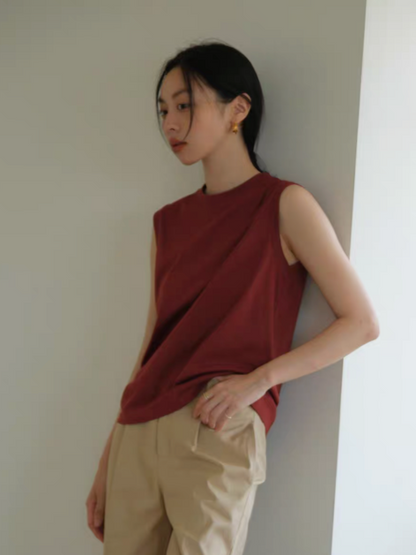 Vintage Chic Sleeveless Cotton Tee red color side view model leaning against wall with beige pants