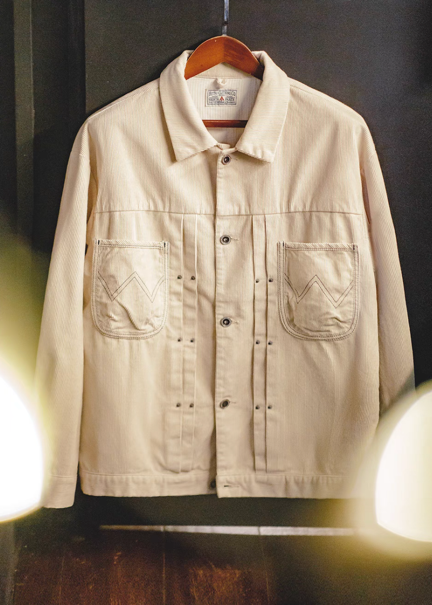 Off-White Vintage Corduroy Trucker Jacket Type II hanging on rack showing corduroy fabric texture and structured silhouette