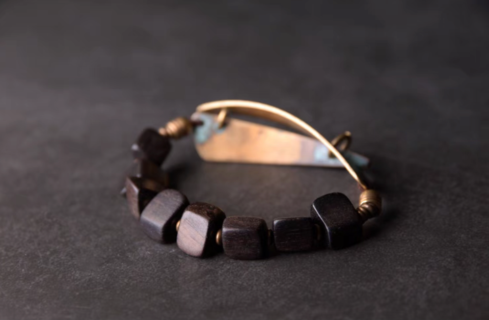 Back view of vintage ebony wood bead bracelet with irregular coffee brown beads and brass elements