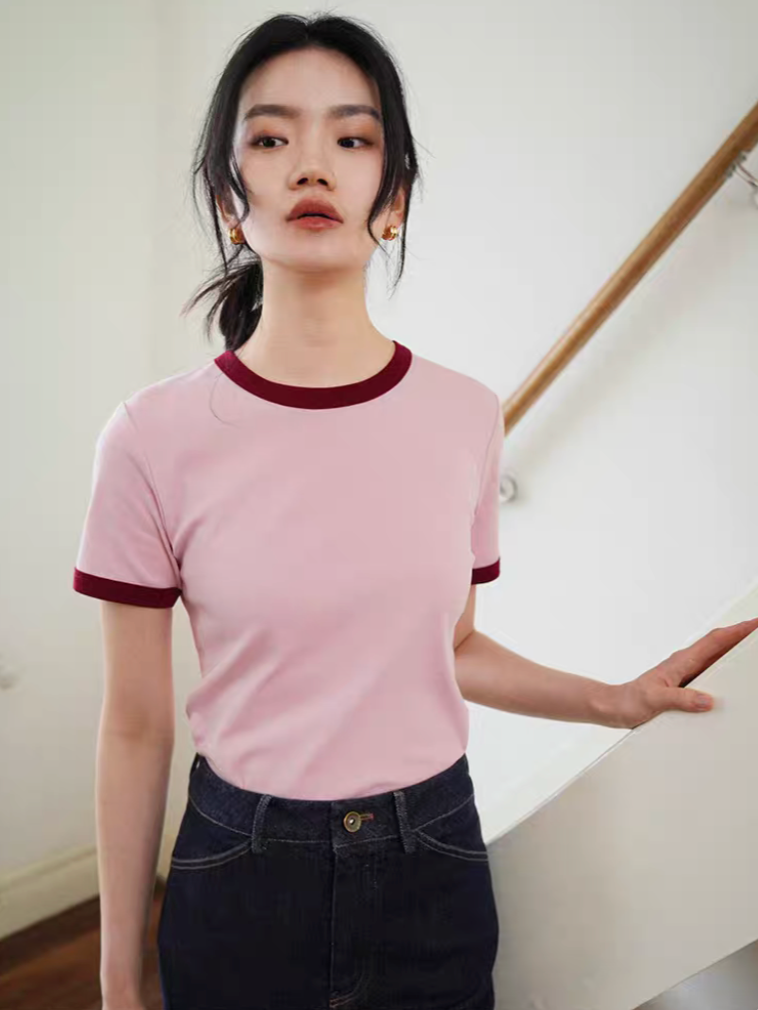 Model wearing Vintage French Contrast Collar Tee in pink with red trim styled with dark denim showing slim fit and retro contrast neckline