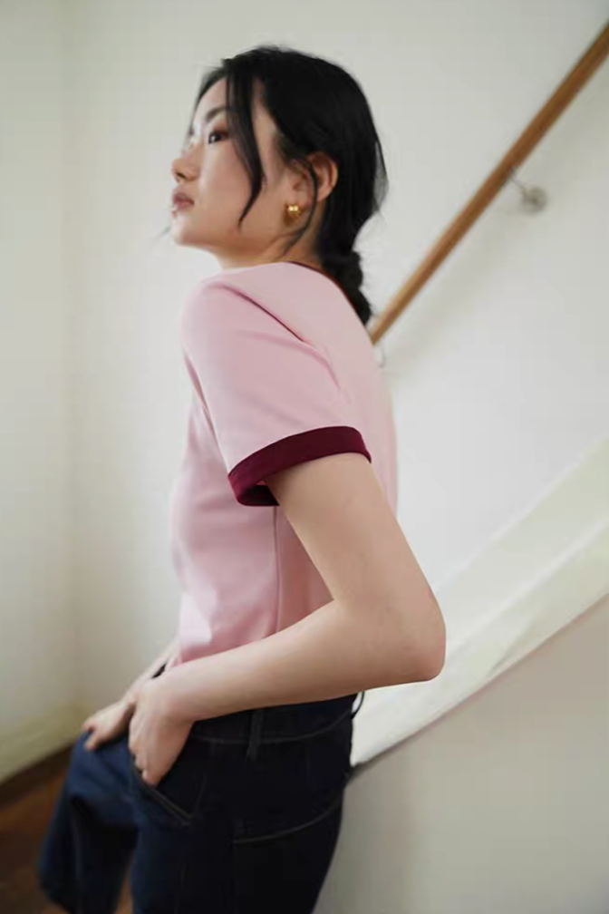 Side view of Vintage French Contrast Collar Tee in pink with red trim showing soft cotton fabric and fitted casual silhouette