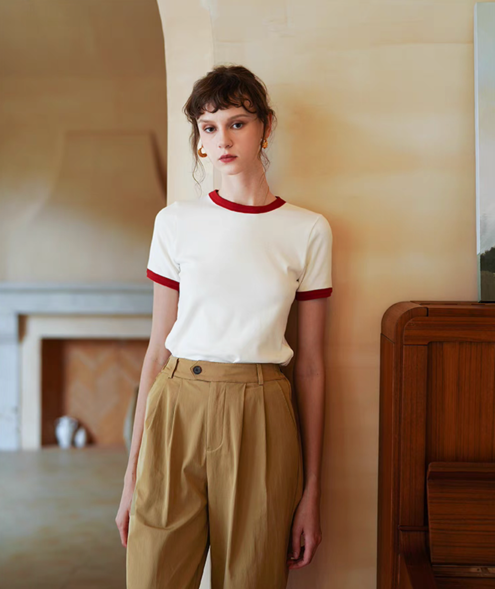 Full body view of Vintage French Contrast Collar Tee in white with red trim paired with high waist pants showing clean fitted silhouette