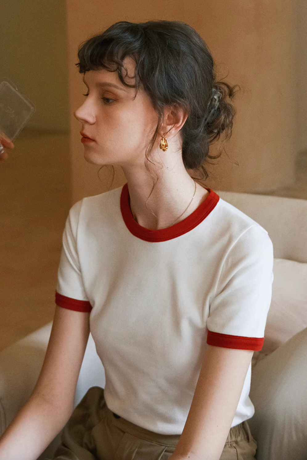 Side profile of model in Vintage French Contrast Collar Tee white with red trim highlighting fitted shape and contrast collar detail