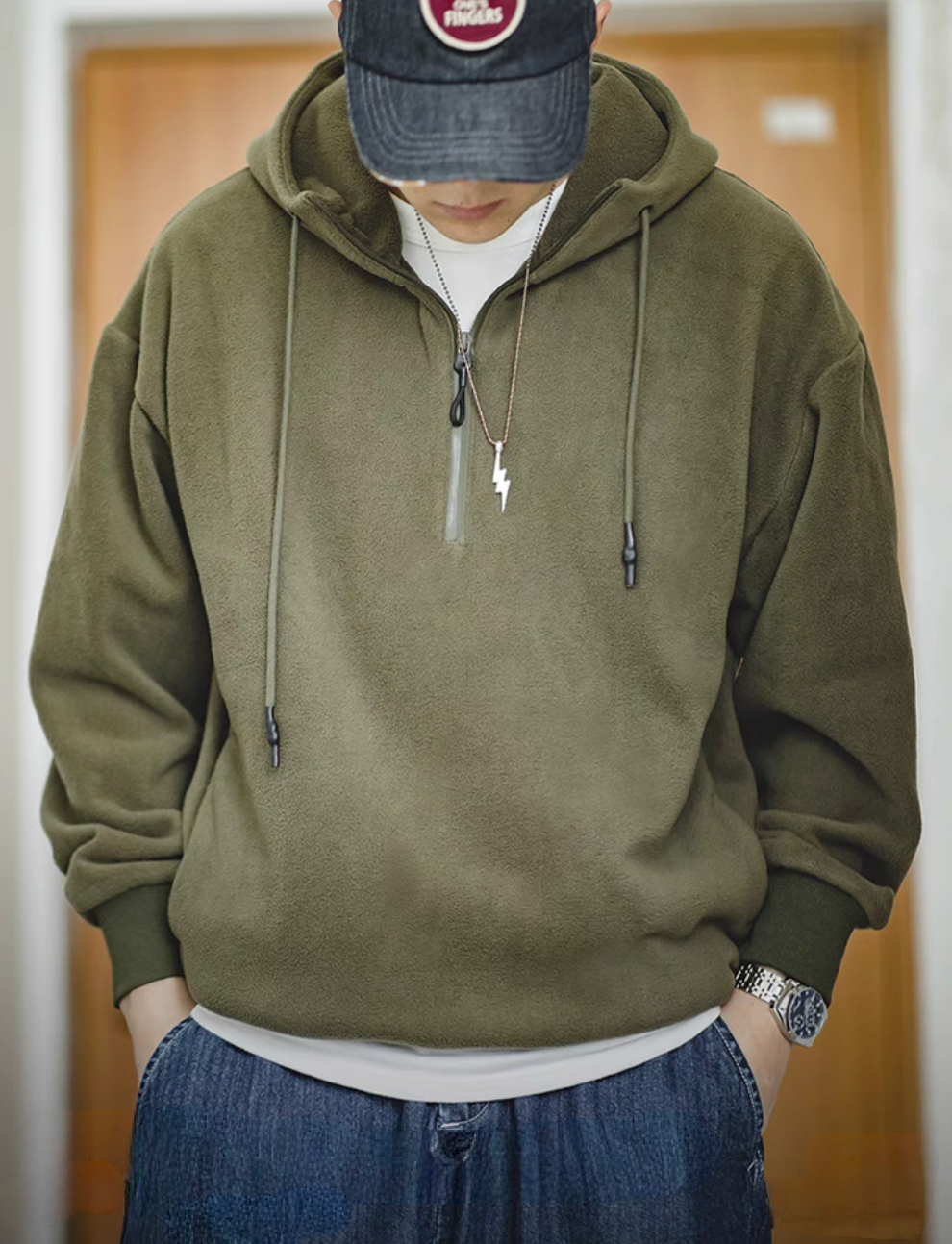 Vintage Half-Zip Fleece Hoodie in Army Green worn by model, front view showing relaxed fit, drawstring hood and half-zip fleece design
