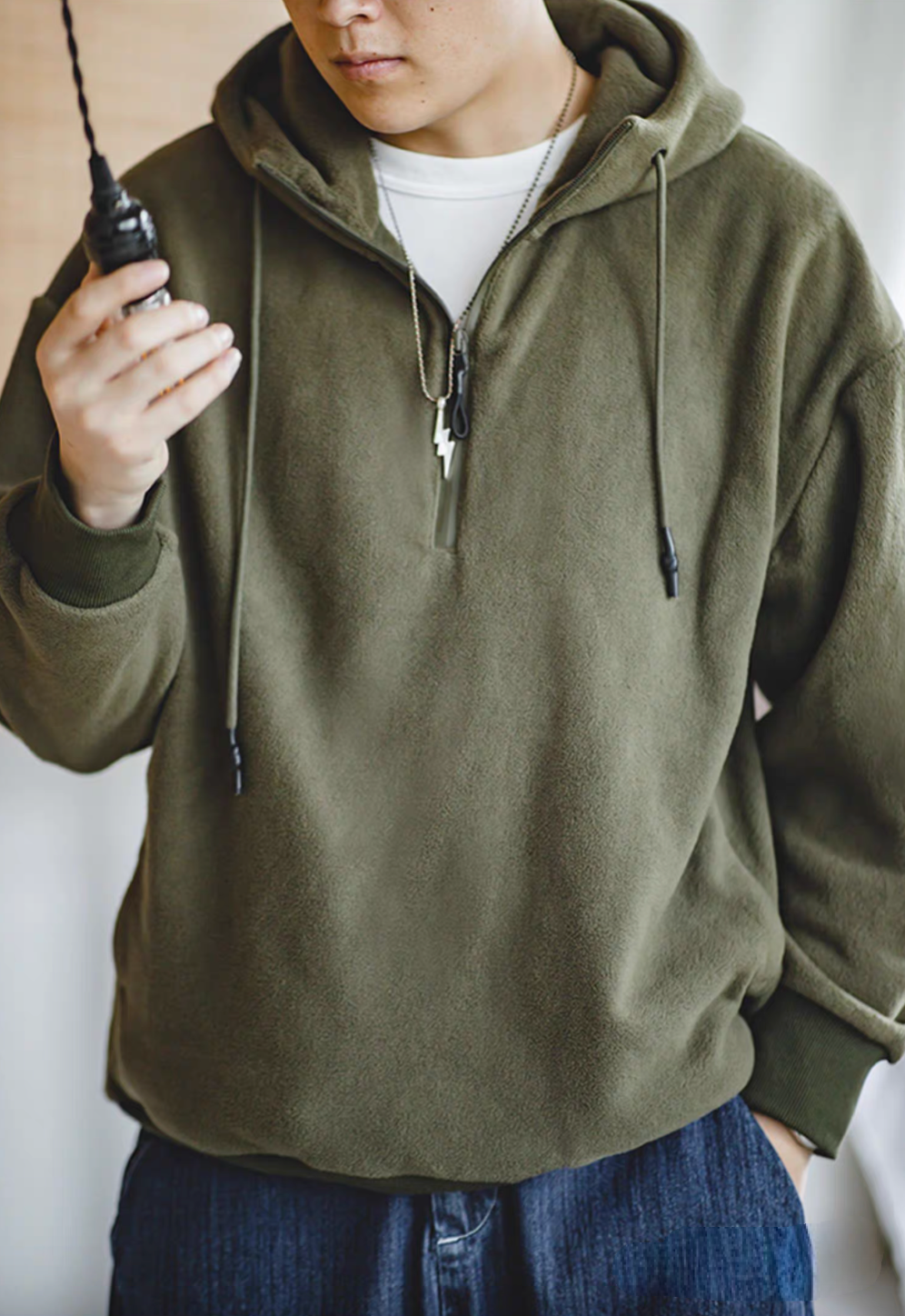 Vintage Half-Zip Fleece Hoodie in Army Green worn by model, upper body view showing half-zip front, drawstring hood and soft fleece texture