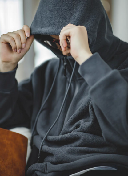 Vintage Half-Zip Fleece Hoodie in Slate Gray close-up of model wearing hood up, showing soft fleece texture and drawstring hood detail