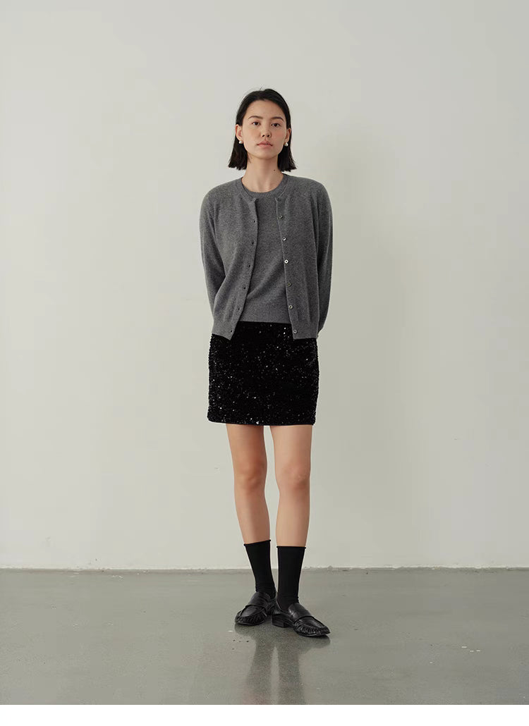 Gray Vintage-Inspired Wool Cardigan styled with black mini skirt, modern chic outfit with soft wool knit