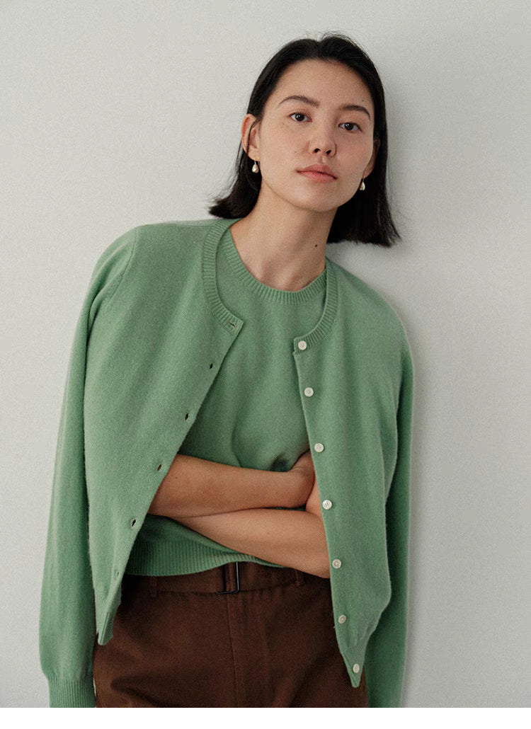 Vintage-Inspired Wool Cardigan in green, front view on model, classic crewneck button knit with soft wool texture and relaxed fit