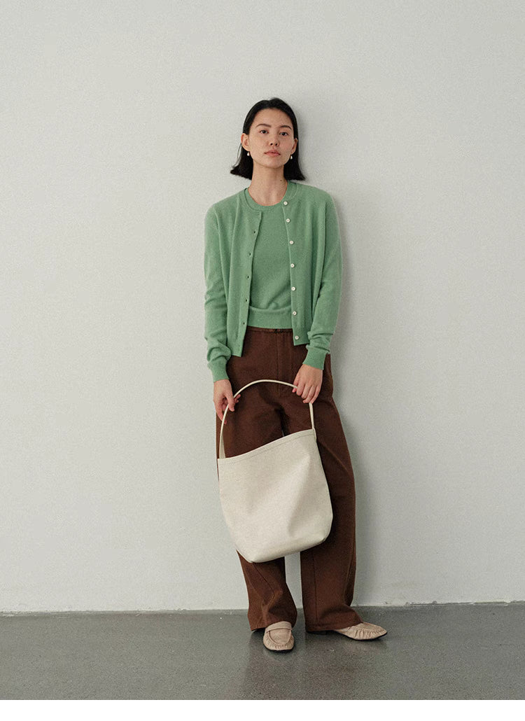 Green Vintage-Inspired Wool Cardigan styled with brown pants and tote bag, relaxed casual everyday outfit