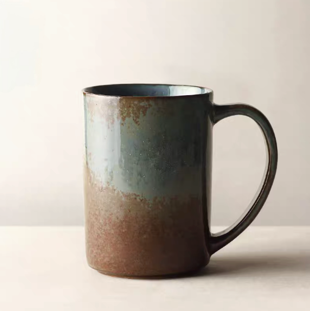 Blue gray vintage rustic ceramic mug with earthy gradient glaze and textured finish shown in clean studio background