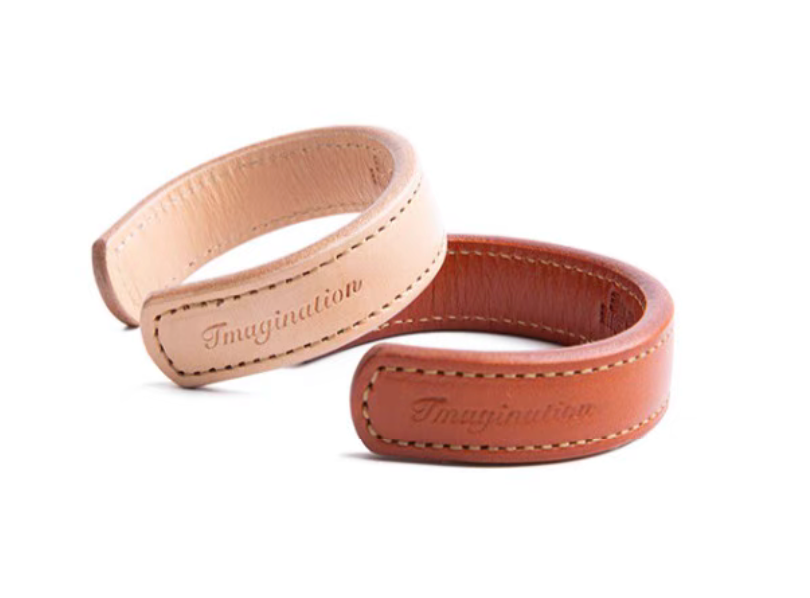 Vintage Thunderbird leather cuff bracelet in dark brown and pink front product view showing imagination embossing and hand stitching