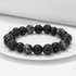 Volcanic essence black lava stone bracelet with matte lava beads, polished black beads, and gray stone accents displayed on white surface