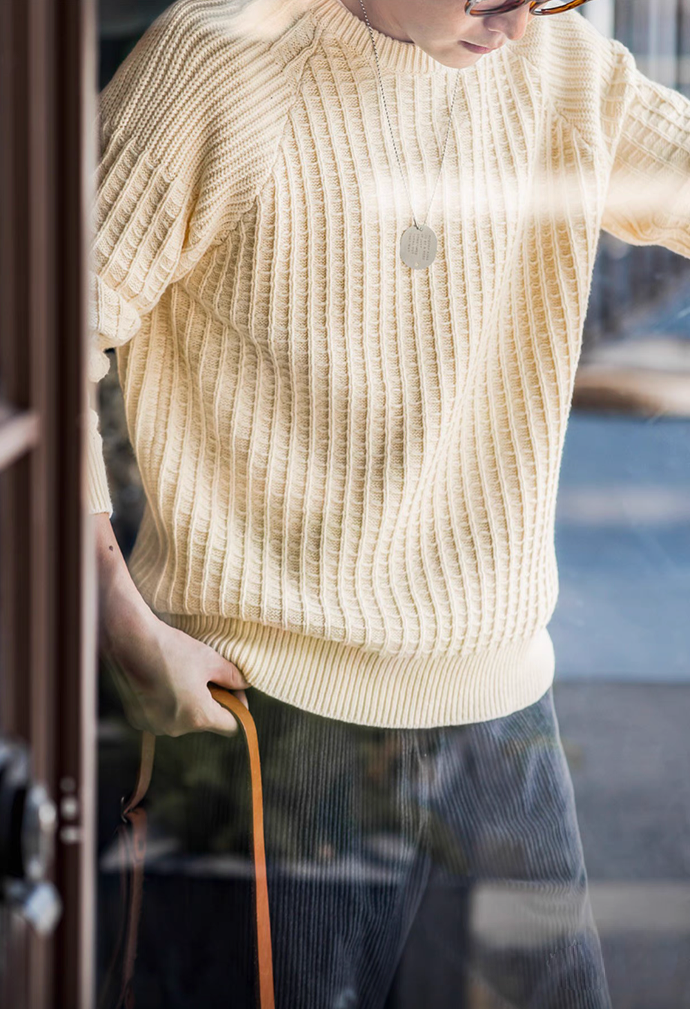 Waffle Knit Crewneck Sweater off-white side view highlighting waffle texture, ribbed hem, and comfortable relaxed fit