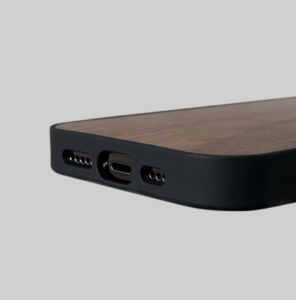 Walnut wood MagSafe phone case bottom view showing precise charging port and speaker cutouts
