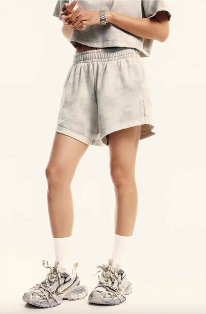 Beige washed lounge shorts front close-up on model relaxed fit