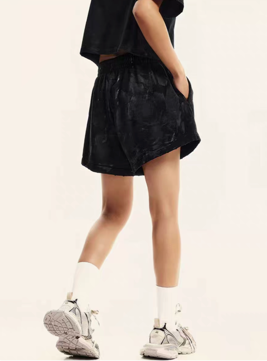 Black washed lounge shorts side back view on model with relaxed fit