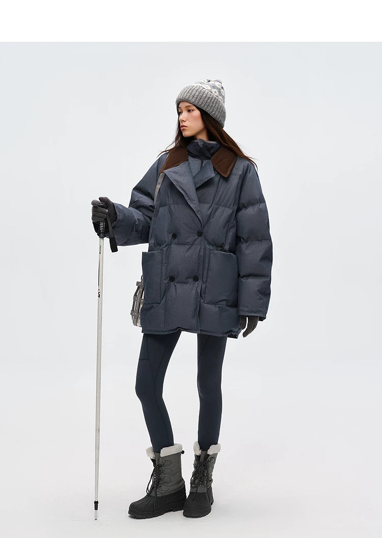Full-length view of oversized slate blue denim down coat with leggings and snow boots