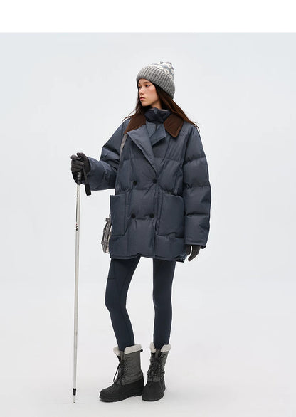 Full-length view of oversized slate blue denim down coat with leggings and snow boots