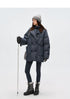 Full-length view of oversized slate blue denim down coat with leggings and snow boots