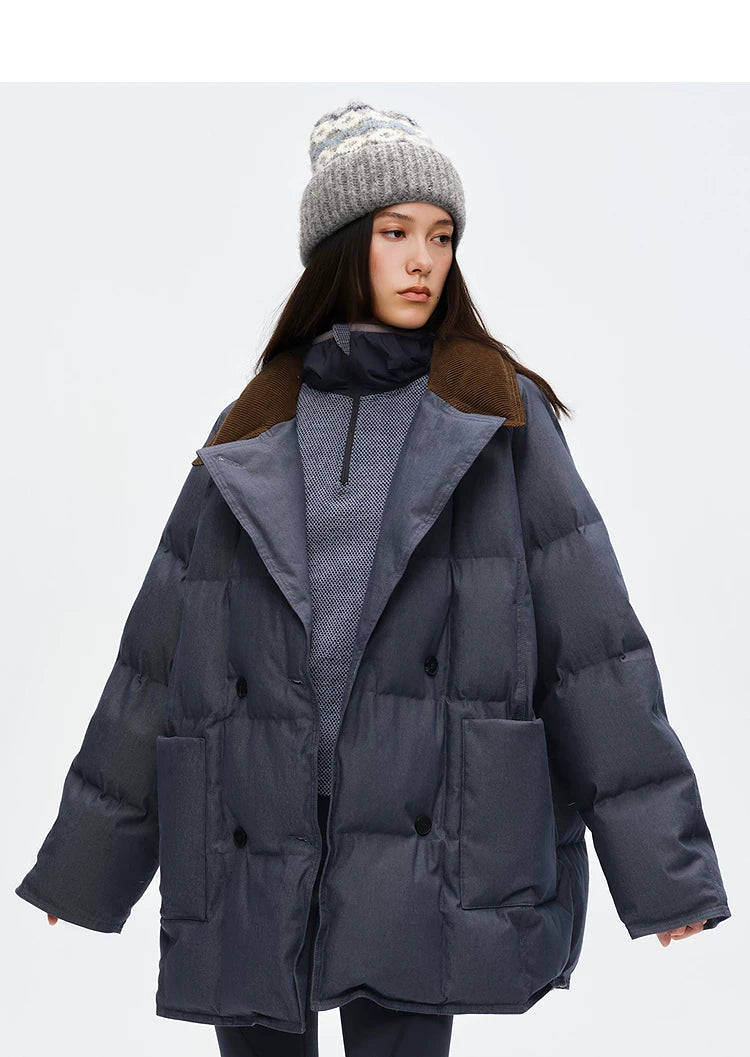 Close front view of brown corduroy collar, notched lapels and turn-back cuffs on denim down coat