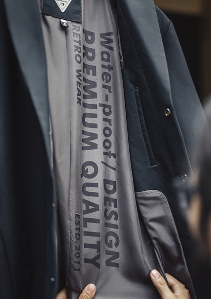 Premium lining with retro text inside waterproof Mac coat