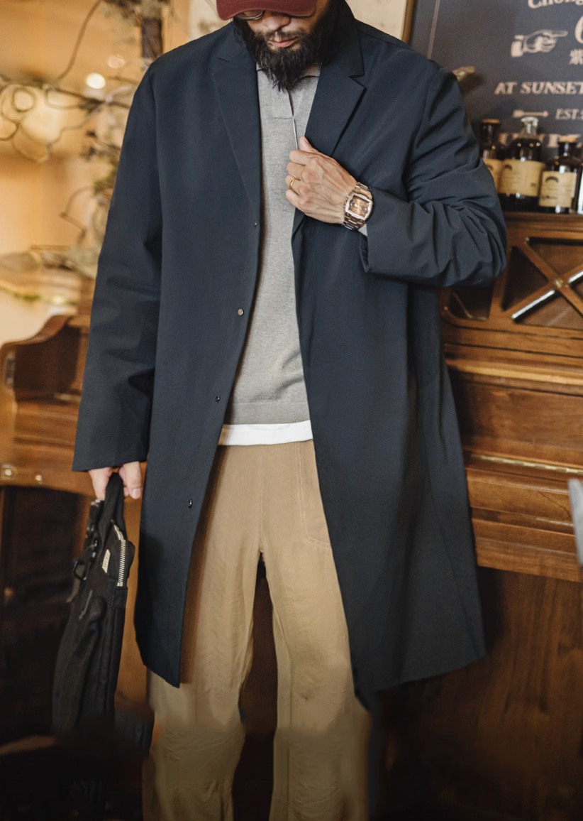 Men’s navy waterproof Mac coat styled for city commute