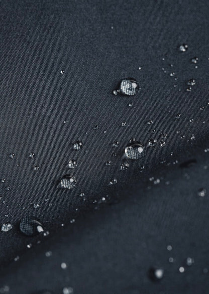 Water beads rolling off waterproof fabric of Mac coat