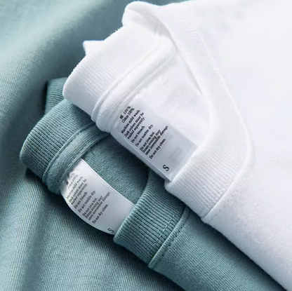 Weekend Vibes Tee ocean blue and white folded shirts stacked together showing soft cotton texture