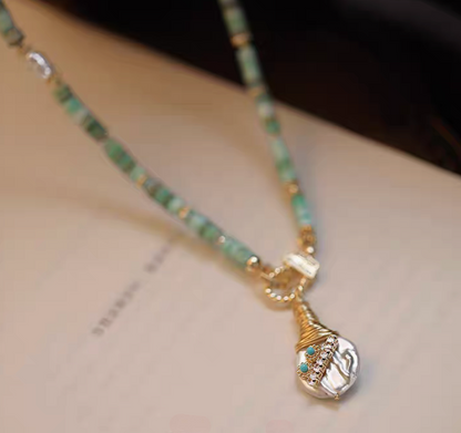 Whimsical Baroque Pearl and Shell Choker featuring baroque freshwater pearl pendant with mother of pearl details close-up