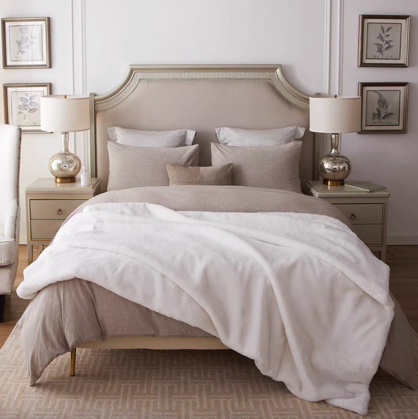 White reversible faux fur throw blanket spread across bed for cozy elegant bedroom styling