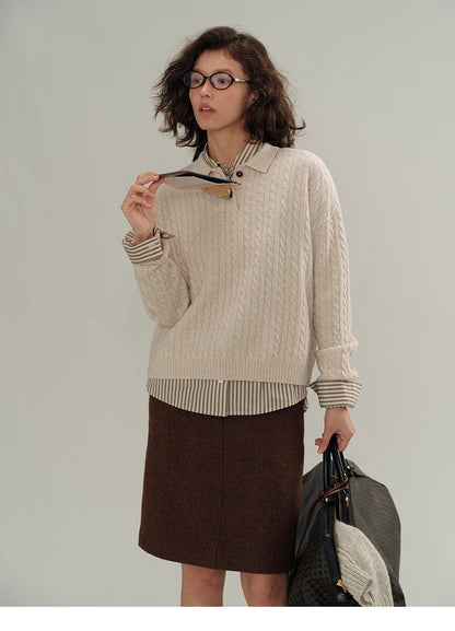 Full outfit with beige wool cable-knit polo sweater layered over striped shirt and brown skirt