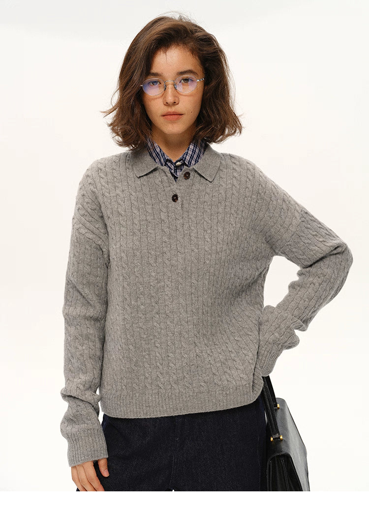 Model wearing light grey cable-knit wool polo sweater, front-facing pose