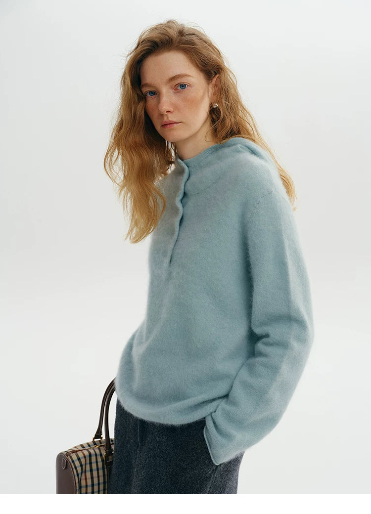 Close-up of dusty blue wool-cashmere hooded sweater collar detail