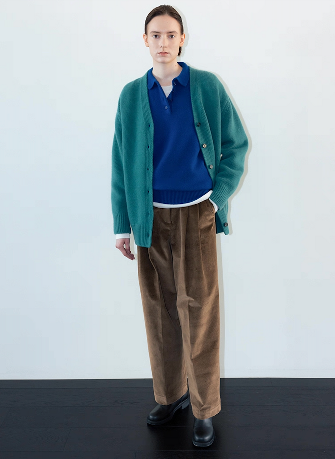 Wool cashmere polo sweater in dark blue layered with green cardigan