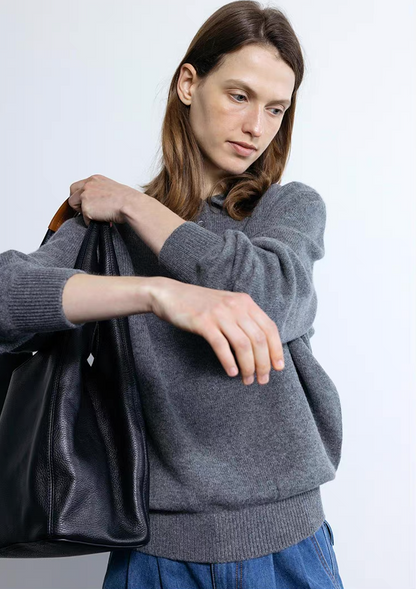 Dark gray wool cashmere polo sweater paired with black tote bag
