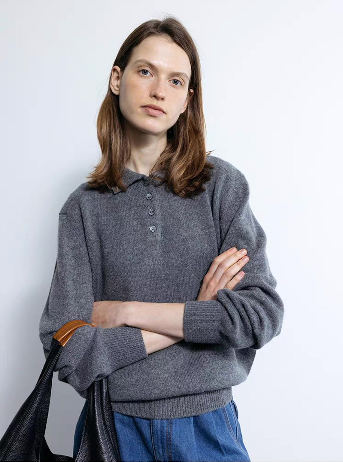 Full outfit view of wool cashmere polo sweater in dark blue